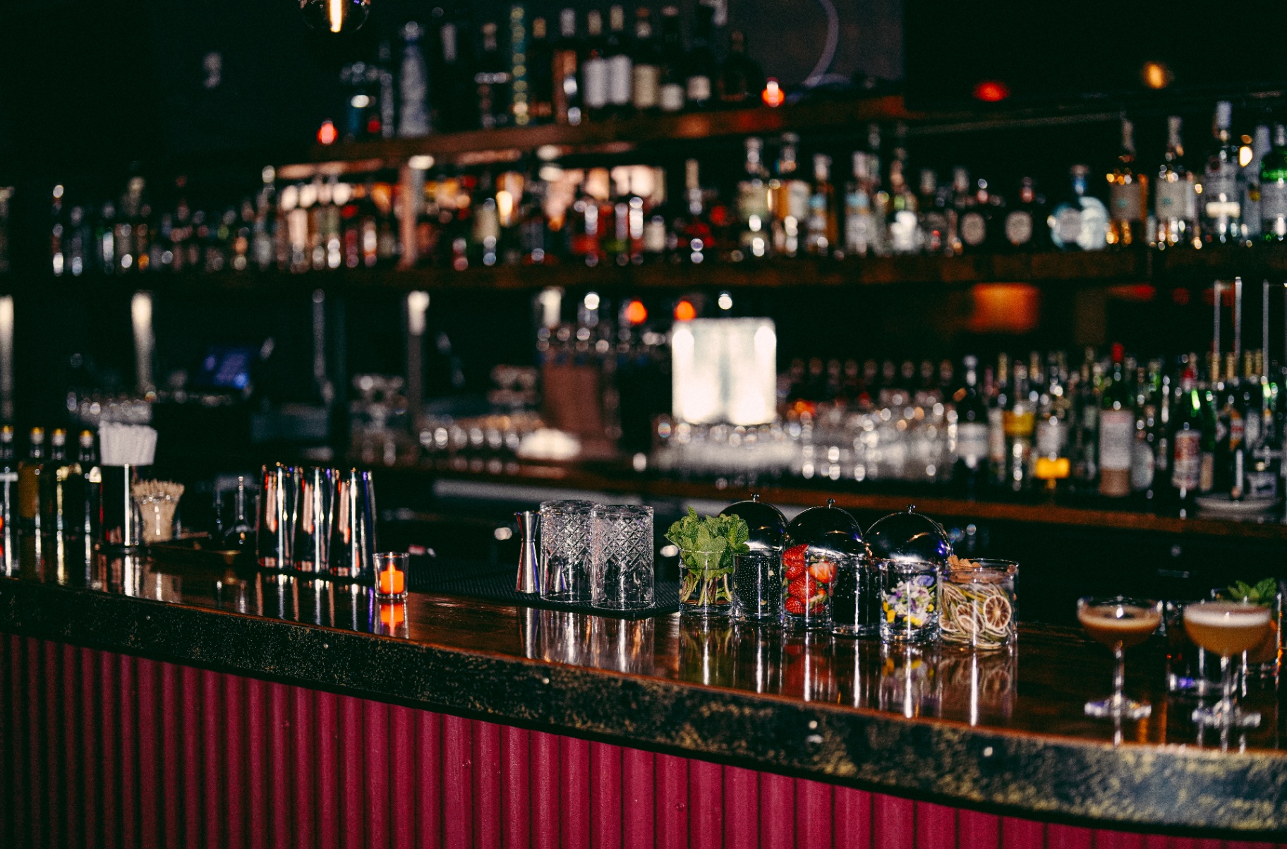 The dimly lit interior of The Lower speakeasy